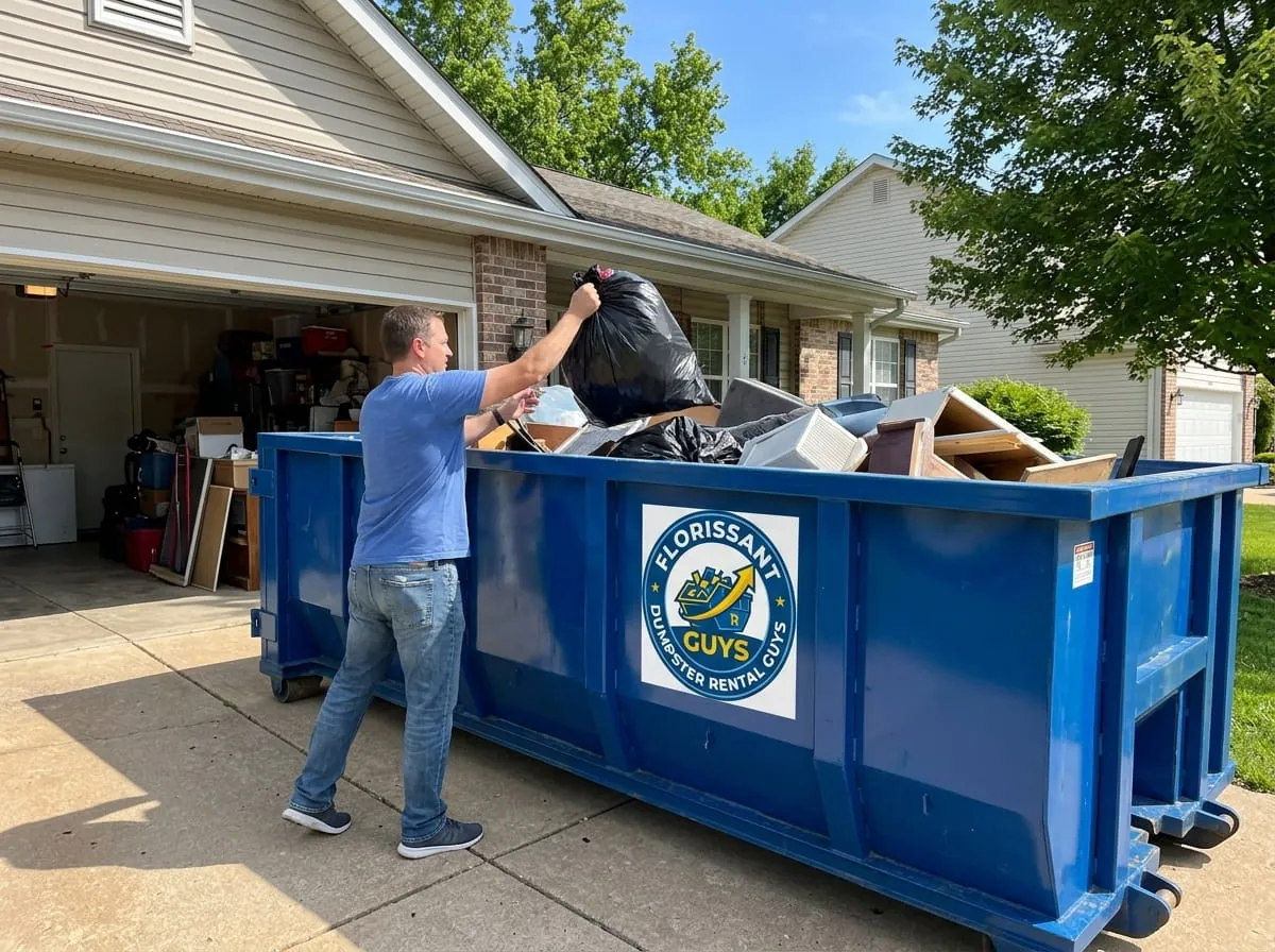 Homeowner loading household junk into a roll-off dumpster in Florissant, Missouri Homeowner loading household junk into a roll-off dumpster in Florissant, Missouri